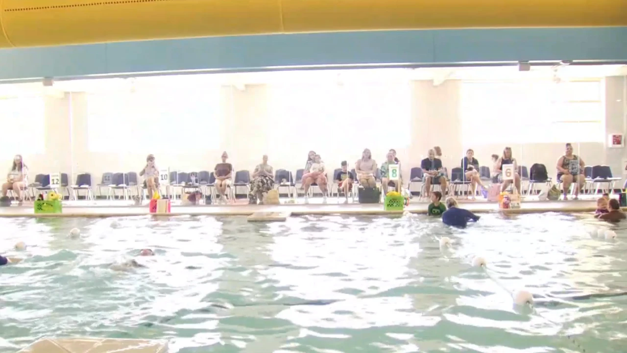 Parents watch as kids under swim lessons at Miller Swim School