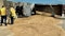 Dump truck overturns on Highway 169, fuel leak prompts traffic delays