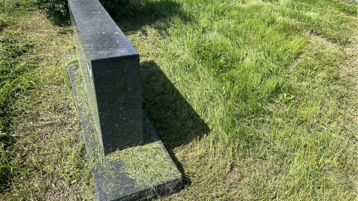 Another grave covered in grass