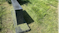 Another grave covered in grass