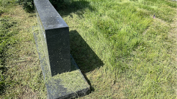 Another grave covered in grass