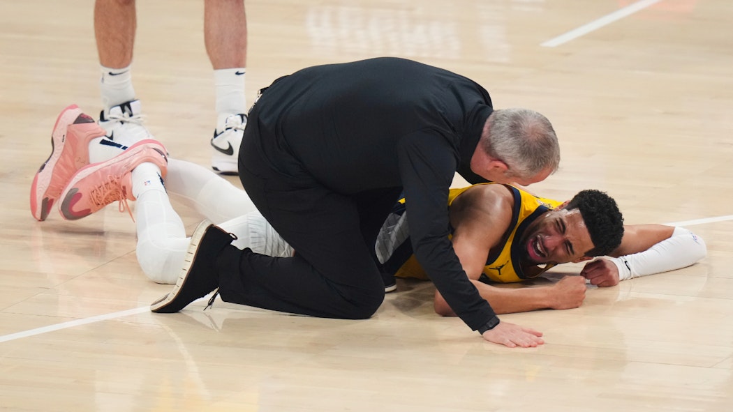 Tyrese Haliburton lays on the court after an injury 